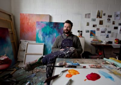 artist calum matheson sits in his studio in glasgow