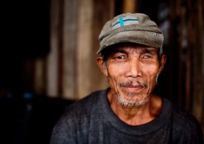 a filipino man who is blind in one eye poses for the camera