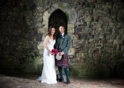 a bride and groom photographed on their wedding in rodel church in harris
